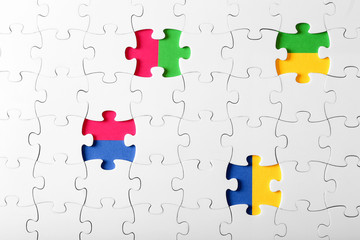 Assembled puzzles with color inserts inside top view