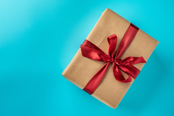 Flat lay of gift on blue background
