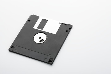 Old computer diskette over white background. Black Diskette.