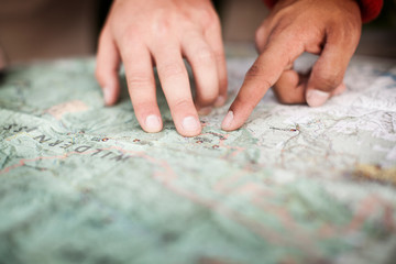 Cropped image of people pointing at map © Cavan for Adobe