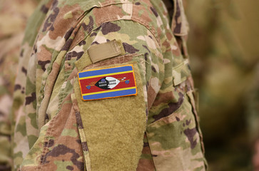 Kingdom of Eswatini, also known as Swaziland flag on soldiers arm. Kingdom of Eswatini troops (collage)