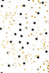 Festive holiday background with sparkle glitter decoration. Flat lay, top view Christmas or New Year pattern.