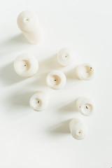 Minimal candles collage. Flat lay, top view.