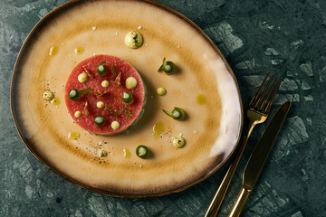 Fresh Beef tartare Steak with egg yolk, pistachios