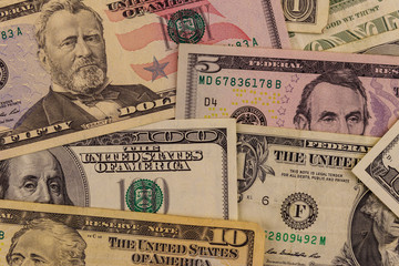 Background of different dollar banknotes