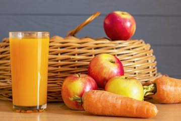 Fresh juice with apples and carrots on wooden table, organic food, healthy eating