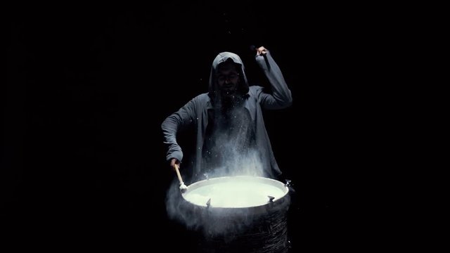 emotional drummer on a black background