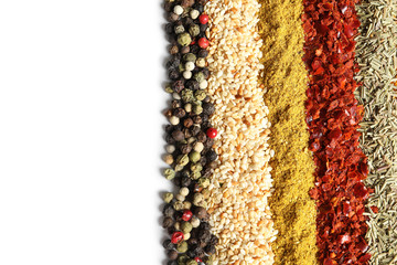 Rows of different aromatic spices on white background, top view with space for text