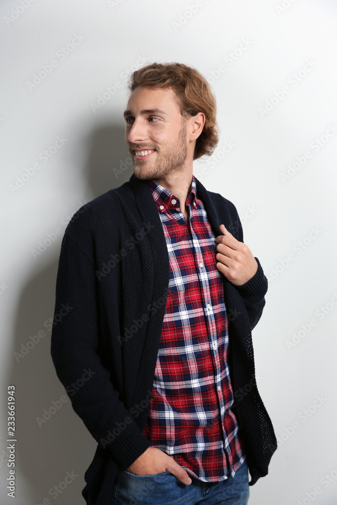 Sticker handsome young man in shirt and warm sweater on white background