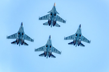 Fighter aircrafts taking off in the sky.