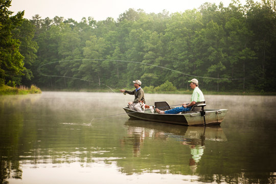 Friends fishing in lake