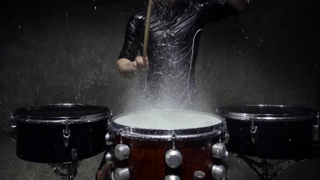 drummer in the rain close up