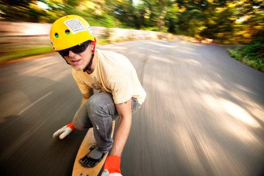Man longboarding on road