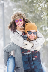 Happy young couple in snow outdoors