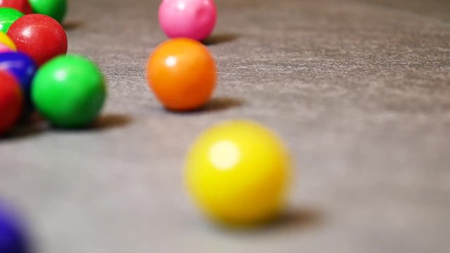 Close up, rolling gumballs