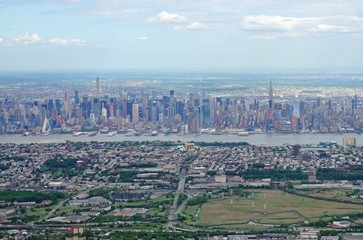Aerial view of the Manhattan skyline in New York City seen from an airplane window in New Jersey