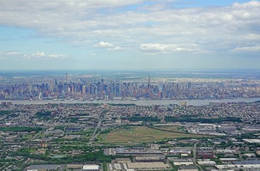 Aerial view of the Manhattan skyline in New York City seen from an airplane window in New Jersey