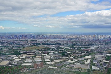 Aerial view of the Manhattan skyline in New York City seen from an airplane window in New Jersey