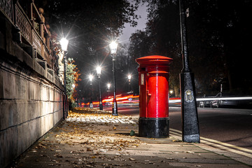 Classic red post box in London in the night