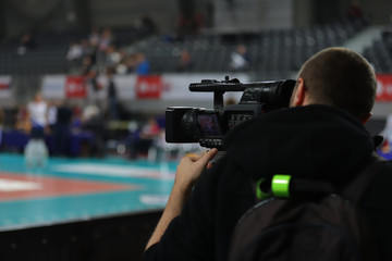 professional cameraman filming sport, Poland