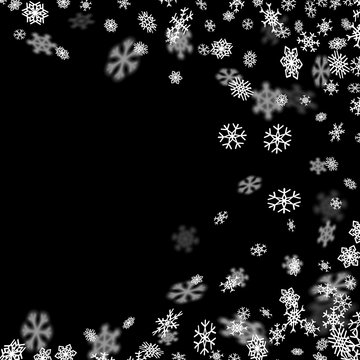 Snowfall background with snowflakes blurred in the dark