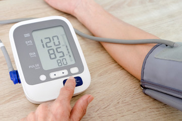 Human check blood pressure monitor and heart rate monitor with digital pressure gauge. Health care and  Medical concept