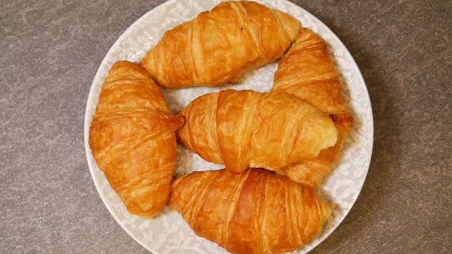 Spinning croissant dish, close up