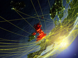United Kingdom on model of planet Earth with network during sunrise. Concept of new technology, communication and travel.