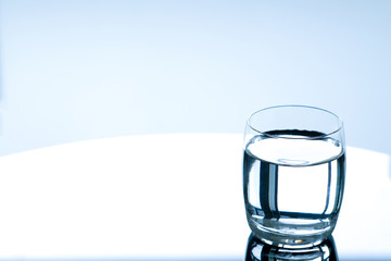 Clean drinking water in clear glass. Put on the table in the reception room Health care concept