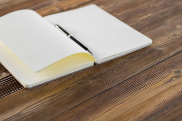 Fototapeta premium book blank open on wood background. Top view.Vintage style.
