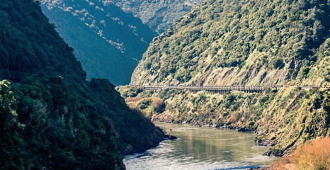 Landscape image of the Manawatu Gorge taken on it's last operational day. The gorge was closed permanently after landslides made it unsafe for travel. © MollyNZ