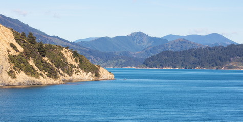 Naklejka na ściany i meble Landscape image of the sea and land that makes up the breath taking scenery of the Marlborough Sounds in New Zealand.