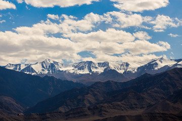 Snow covered Mountains under blue sky in Leh, Ladakh, Jammu and Kashmir, India