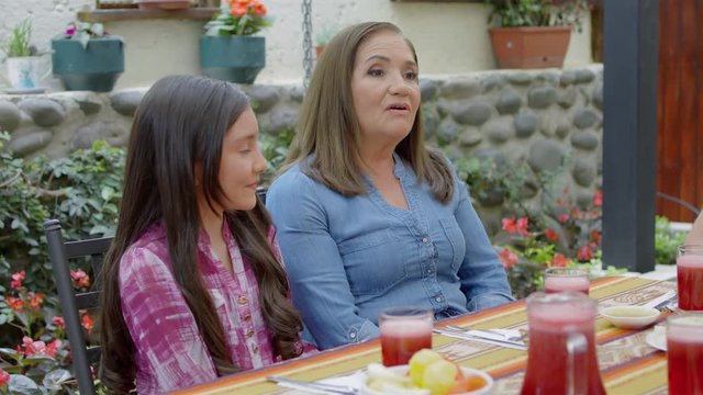 Hispanic family eating traditional meal together
