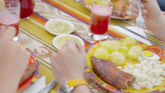 Hispanic family eating traditional meal together