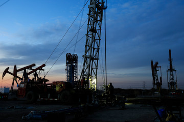 Fototapeta na wymiar Oil drilling platform in the beautiful night