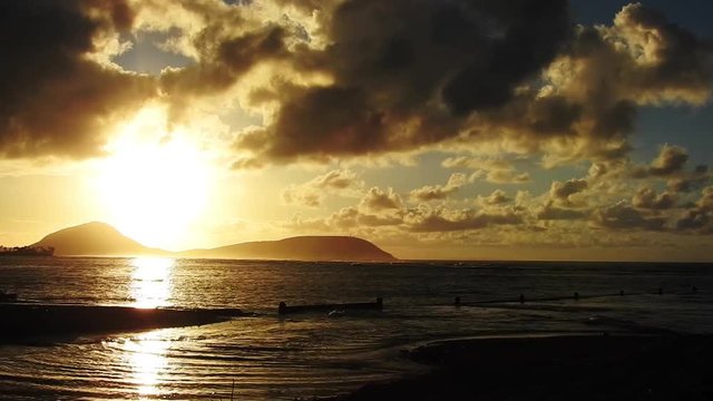 Early Morning Sunrise Kayaker at Kahala Beach in Honolulu on the Island of Oahu, Hawaii.