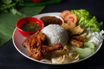nasi lemak kukus with drumpstick malaysian local food