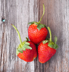 Strawberry on old wood background