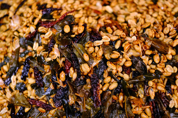 Fried peanut with chilly pepper - traditional asian street food. Asian, Indian and Chinese street food. Food court on local market of Langkawi island, Malaysia.