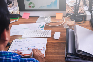 Businessman thinking plan all about money return on investment on chair in office with notebook