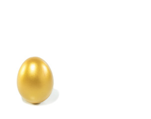 Golden egg with copy space on isolated white background.