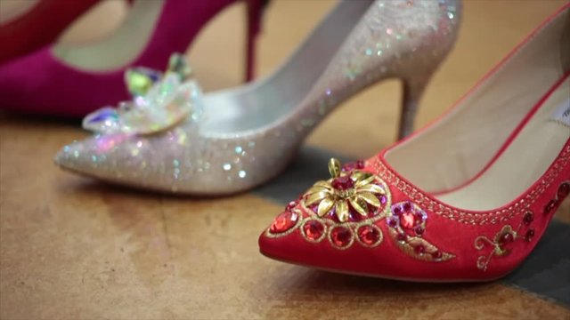 Close up shoot of sparkly jewel encrusted high heel shoes