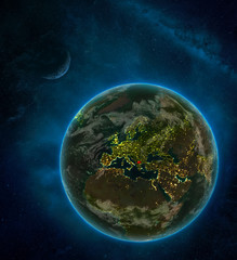 Macedonia from space on Earth at night surrounded by space with Moon and Milky Way. Detailed planet with city lights and clouds.