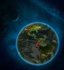 Obraz na płótnie Canvas Ecuador from space on Earth at night surrounded by space with Moon and Milky Way. Detailed planet with city lights and clouds.