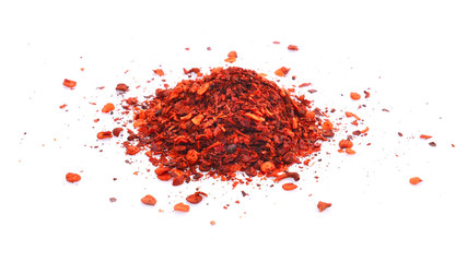 pile crushed red cayenne pepper, dried chili flakes and seeds on white background.