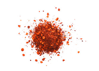 pile crushed red cayenne pepper, dried chili flakes and seeds on white background. - obrazy, fototapety, plakaty