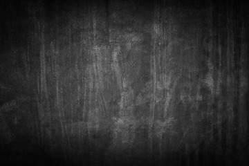 black background. Grunge texture. Dark wallpaper. Blackboard. Chalkboard