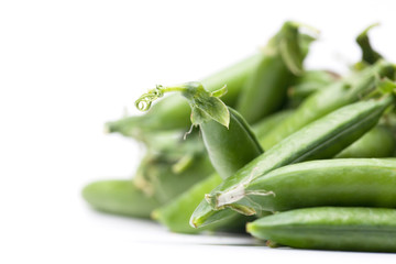 green fresh peas isolated on white background