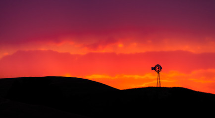 Old windmill in the Palouse of eastern Oregon, USA at sunset